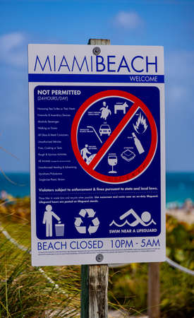 Miami Beach information sign at South Beach - MIAMI, FLORIDA - FEBRUARY 14, 2022のeditorial素材