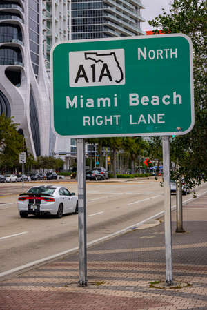 Street sign to Miami Beach and A1A - MIAMI, FLORIDA - FEBRUARY 14, 2022のeditorial素材