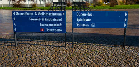 Direction signs at the Beach of St Peter Ording in North Frisia - NORTH FRISIA, GERMANY - DECEMBER 21, 2021のeditorial素材