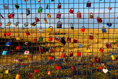 Love Locks attached to a board at the Wadden Sea in North Frisia - NORTH FRISIA, GERMANY - DECEMBER...