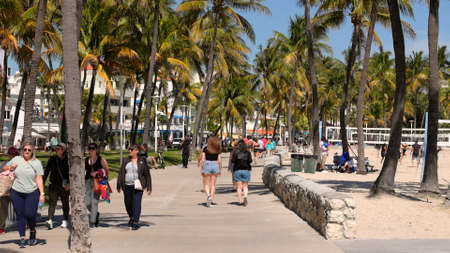 Walking at Ocean Drive Miami Beach on a sunny day - MIAMI, FLORIDA - FEBRUARY 14, 2022のeditorial素材