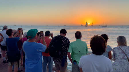 Tourists watch the sunset on Key West - KEY WEST, UNITED STATES - FEBRUARY 20, 2022のeditorial素材