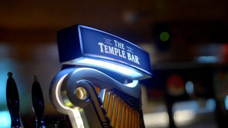 Fresh cold Guinness beer at an Irish Pub in Dublin - DUBLIN, IRELAND - APRIL 20, 2022