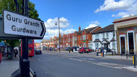 Direction sign to Guru Granth Gurdwara in the city of Southall London - LONDON, UK - JUNE 9, 2022のeditorial素材