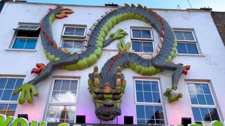 The colorful shops and crazy houses at Camden High Street in London - LONDON, UK - JUNE 9, 2022のeditorial素材