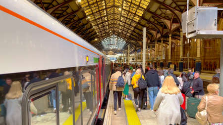 Stansted Express train arriving at London Liverpool Street - LONDON, UK - JUNE 9, 2022
