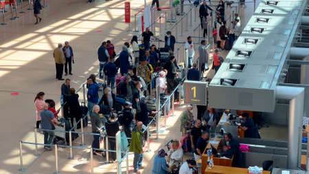 Passengers checking in at Hamburg Airport - HAMBURG, GERMANY - MAY 15, 2022