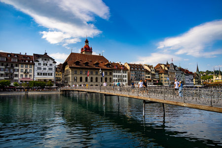 Pedestrian bridge over the River Reuss in Lucerne city centre - LUCERNE, SWITZERLAND - JULY 14, 2022のeditorial素材