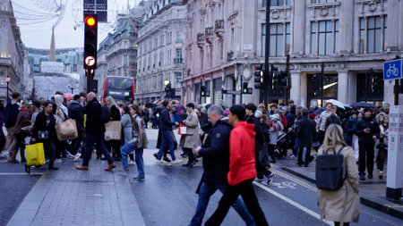 Crowd of People crossing the street at Oxford Circus - slow motion clip - LONDON, UK - DECEMBER 20, 2022のeditorial素材