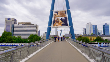 Pedestrian Bridge over River Main in Frankfurt - FRANKFURT, GERMANY - JULY 12, 2022のeditorial素材