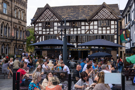 Old Wellington Pub with Beer garden in Manchester - MANCHESTER, UK - AUGUST 15, 2022のeditorial素材