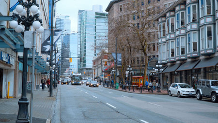 Street view in Gastown - the historic district of Vancouver - CITY OF VANCOUVER, CANADA - APRIL 12, 2017のeditorial素材