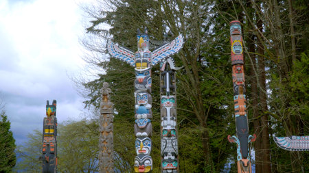 Impressive Totem Poles at Stanley Park Vancouver - CITY OF VANCOUVER, CANADA - APRIL 12, 2017のeditorial素材