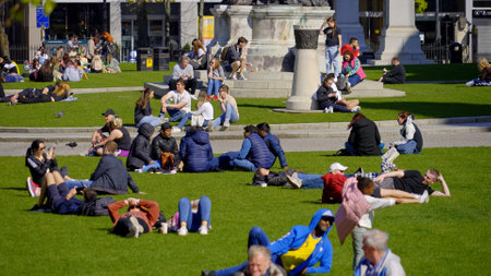 The green meadows at Belfast city hall are a great place to relax - BELFAST, UK - APRIL 25, 2022のeditorial素材