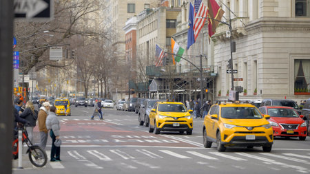 Yellow Taxi cabs at 5th Avenue in New York - NEW YORK CITY, USA - FEBRUARY 14, 2023のeditorial素材