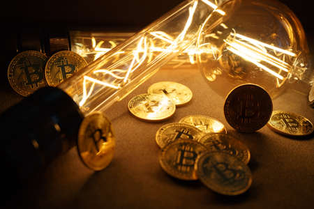 BTC among avid bulbs. The light flashes, an electrical short circuit. Closeup, Shallow depth of fields.の写真素材