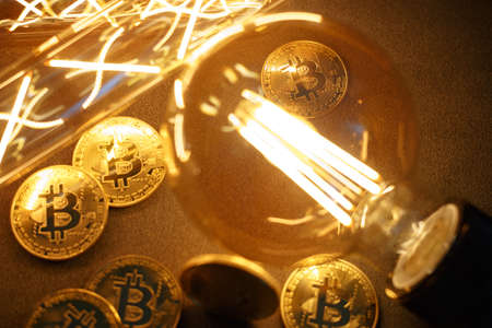 BTC among avid bulbs. The light flashes, an electrical short circuit. Closeup, Shallow depth of fields.の写真素材