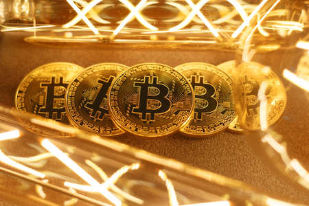 BTC among avid bulbs. The light flashes, an electrical short circuit. Closeup, Shallow depth of fields.の写真素材