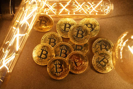 BTC among avid bulbs. The light flashes, an electrical short circuit. Closeup, Shallow depth of fields.の写真素材