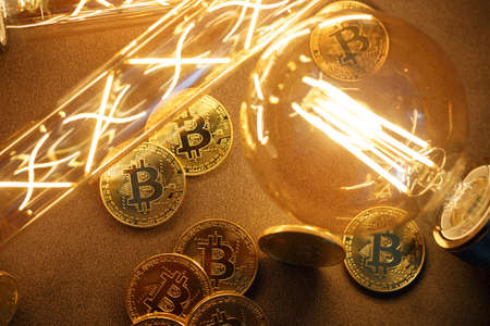 BTC among avid bulbs. The light flashes, an electrical short circuit. Closeup, Shallow depth of fields.の写真素材