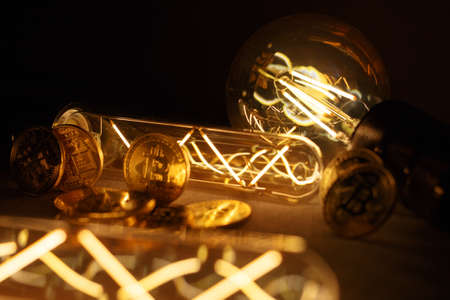 BTC among avid bulbs. The light flashes, an electrical short circuit. Closeup, Shallow depth of fields.の写真素材