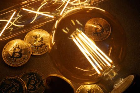 BTC among avid bulbs. The light flashes, an electrical short circuit. Closeup, Shallow depth of fields.の写真素材