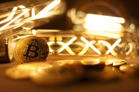 BTC among avid bulbs. The light flashes, an electrical short circuit. Closeup, Shallow depth of fields.の写真素材