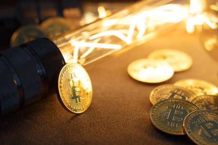 BTC among avid bulbs. The light flashes, an electrical short circuit. Closeup, Shallow depth of fields.の写真素材