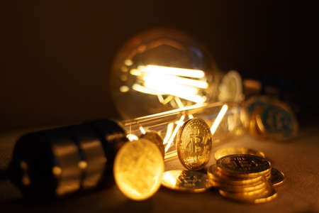 BTC among avid bulbs. The light flashes, an electrical short circuit. Closeup, Shallow depth of fields.の写真素材