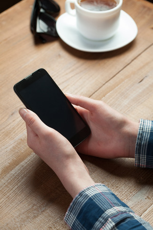 hands holding smartphoneの写真素材
