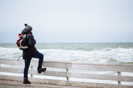 Hiker looking at beautiful ocean viewsの写真素材