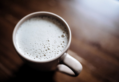 cup of black coffee on wooden tableの写真素材