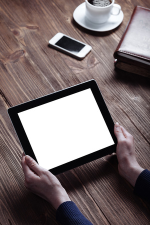 woman shows screen of digital tablet in his hands.の写真素材