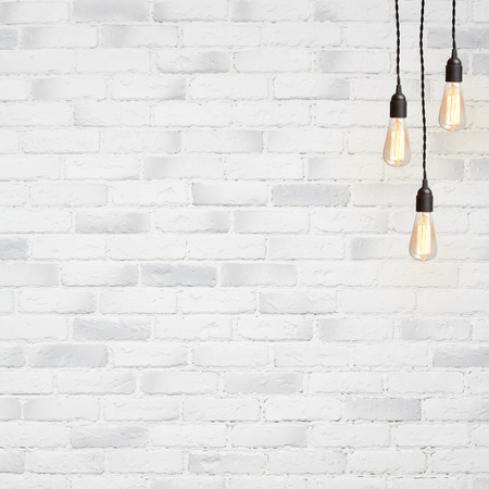 white brick wall background with retro lampの写真素材
