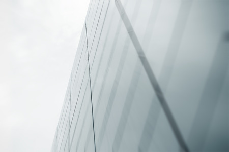 Wide angle abstract background view of steel light blue high rise commercial building skyscraper...