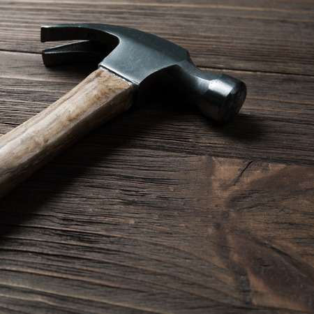 hammer on wooden backgroundの写真素材