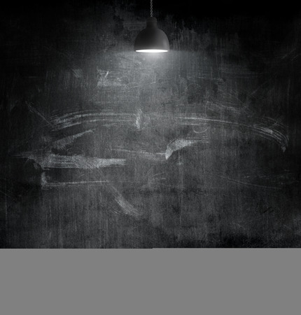 Light bulb lamp on blackboard background with copy spaceの写真素材