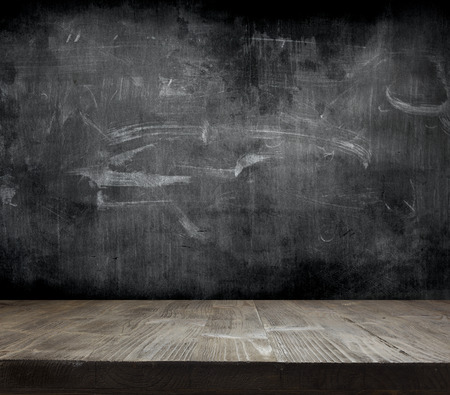 Blank cleaned chalkboard with wooden backgroundの写真素材
