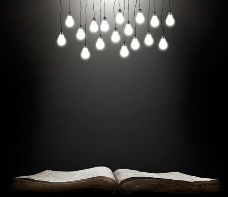 Open book with shining lamps. grunge education conceptの写真素材