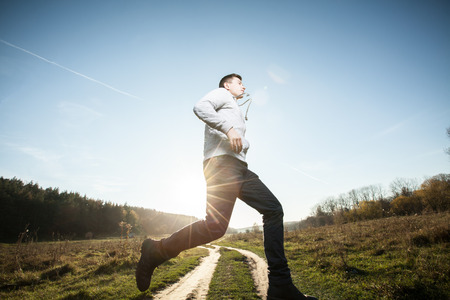 Teenager running in natureの写真素材