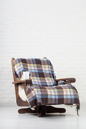 vintage armchair on white wall.の写真素材