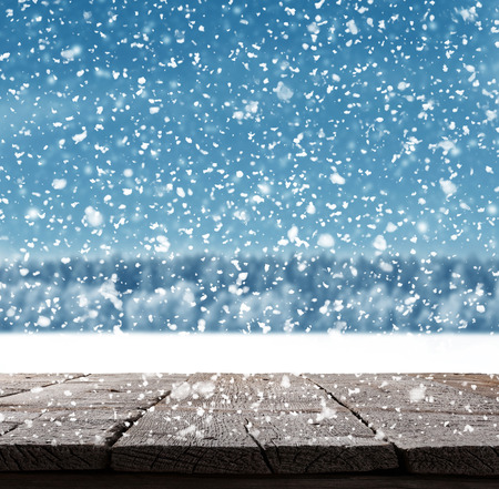 Blue Christmas background with trees and snowの写真素材
