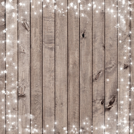 wooden board with snow flakes . Christmas backgroundの写真素材
