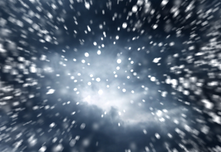 falling snow on the blue background dramatic dark sky backgroundの写真素材