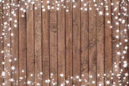 Wooden background with snow flakes . Christmas backgroundの写真素材