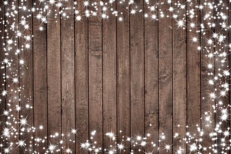 wooden board with snow flakes . Christmas backgroundの写真素材