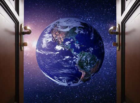room door to Planet earth from the space の写真素材