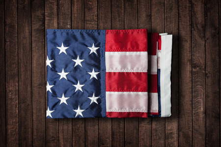 USA flag folded on grunge wood panelsの写真素材