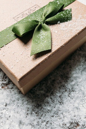 Handmade gift boxe in snow. christmas giftの写真素材