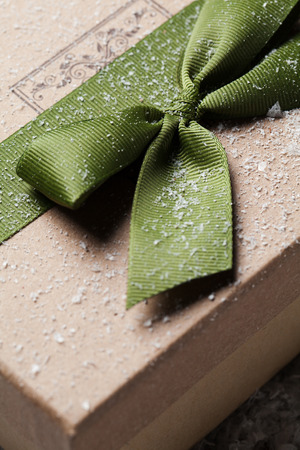 Handmade gift box in snow. christmas giftの写真素材